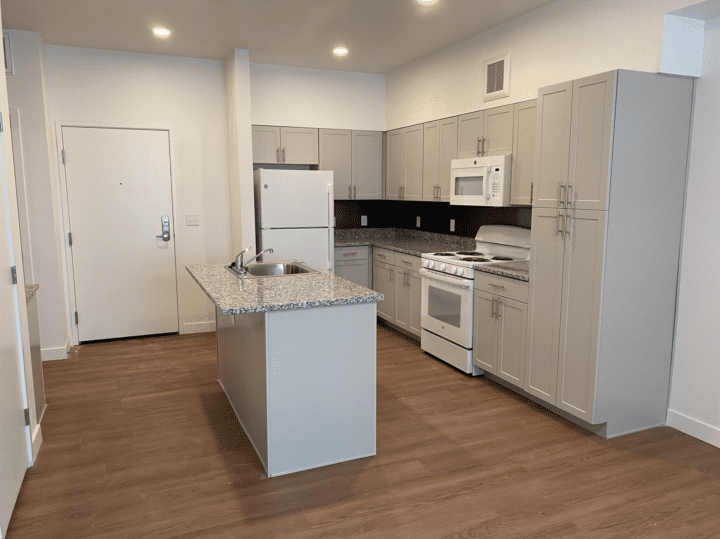 housing-early-education the rose on colfax unit kitchen — Credit: Apartments.com