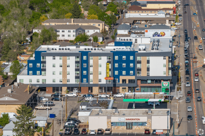 mixed-use housing the rose on colfax elevation change — Credit: Apartments.com