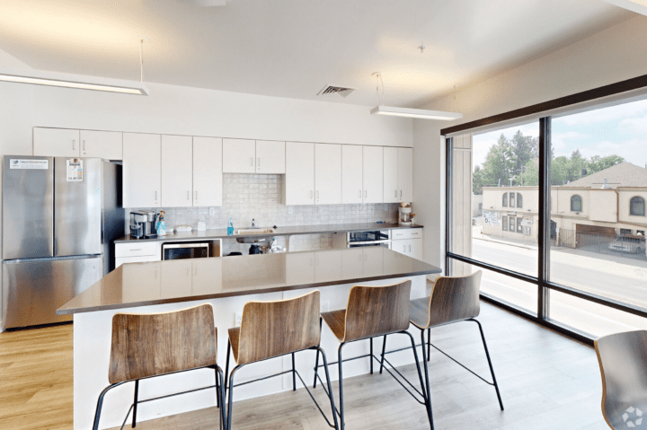 housing-early-education the rose on colfax communal kitchen — Credit: Apartments.com
