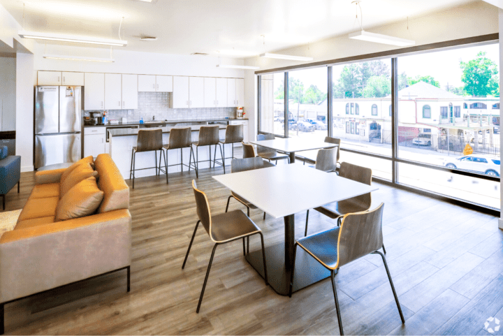 housing-early-education the rose on colfax common room — Credit: Apartments.com