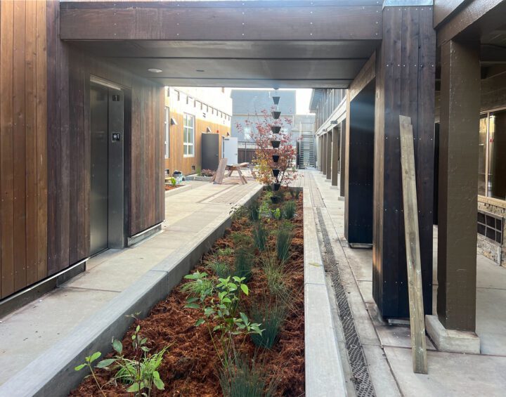 Mother Bernard House, motel conversion, landscaped breezeway — VMWP