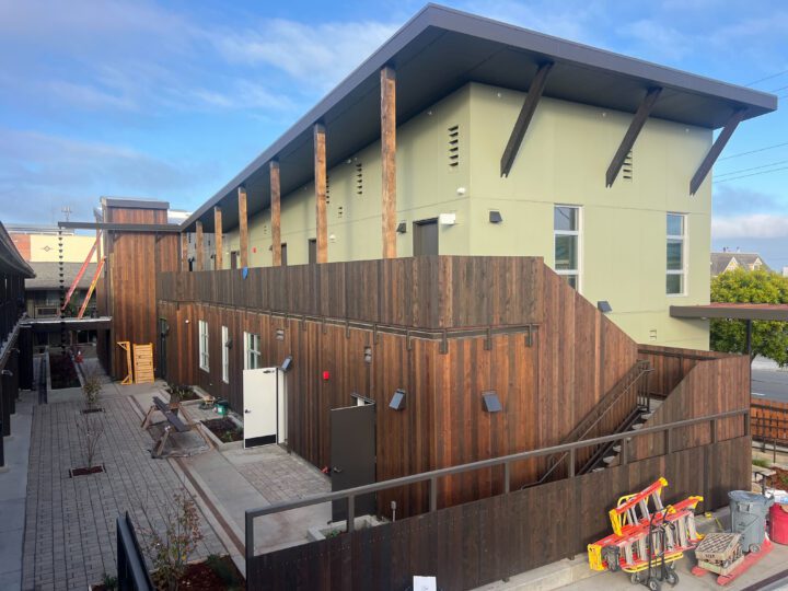 Mother Bernard House, motel conversion, courtyard facade construction — VMWP