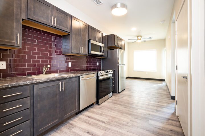 AVi at Olde Town, affordable housing architect, unit kitchen and living area — VMWP