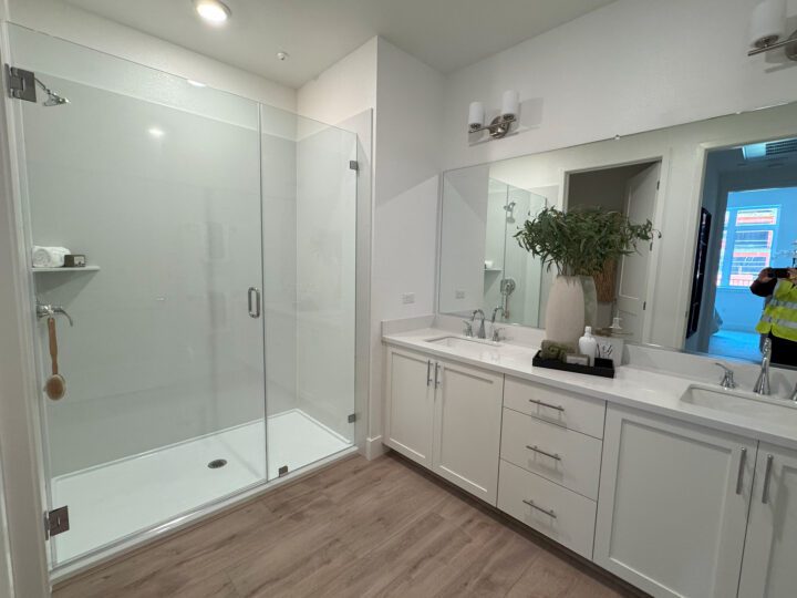 transit oriented condominiums Vantage at The Station bathroom building A — Image: VMWP