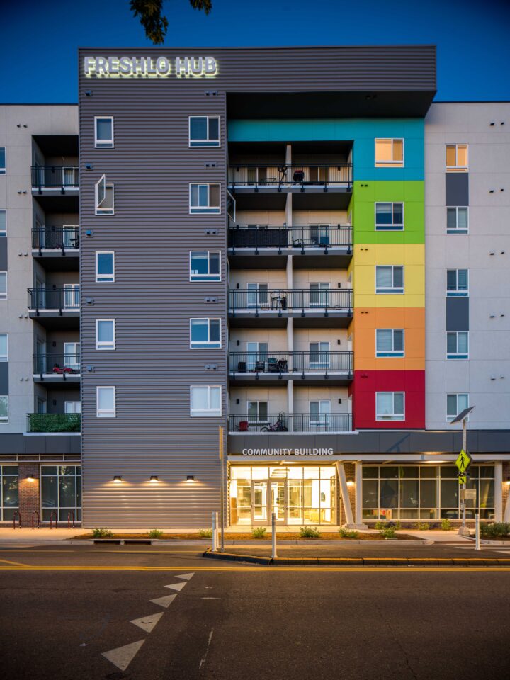 Affordable Housing Atop Mixed-Use Community Montbello FreshLo Hub Denver  entry dawn — Image: Matt Staver