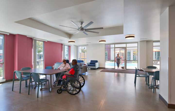 VMWP-Bell-Street-affordable_housing-motel_conversion-supportive-homeless-reuse-common space with people — Photo: Keith Baker