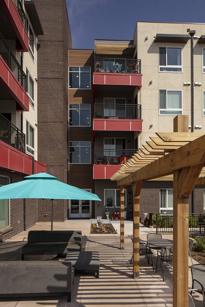 Crossing Point North, Colorado affordable housing, courtyard seating area — VMWP