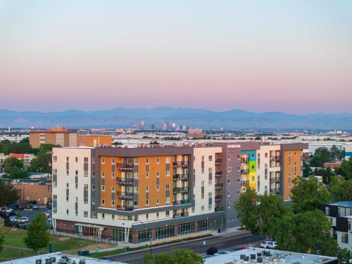 Affordable Housing Atop Mixed-Use Community Montbello FreshLo Hub Denver dusk — Image: Matt Staver