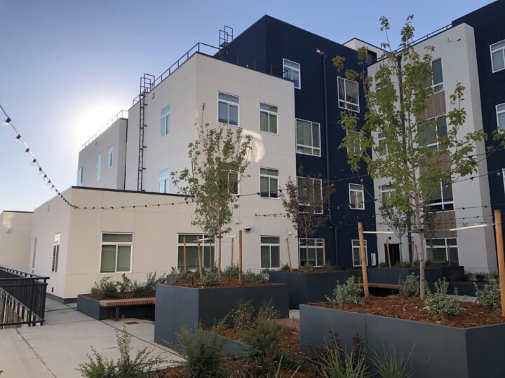 mixed-use housing the rose on colfax courtyard trees