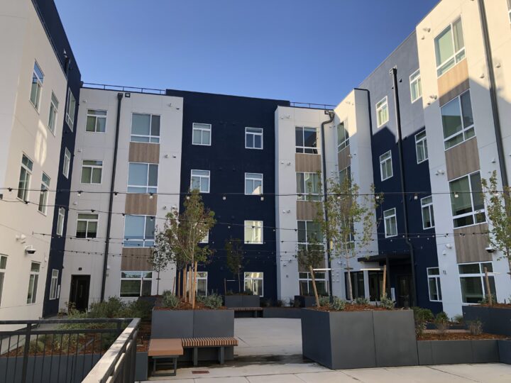 mixed-use housing the rose on colfax courtyard planters