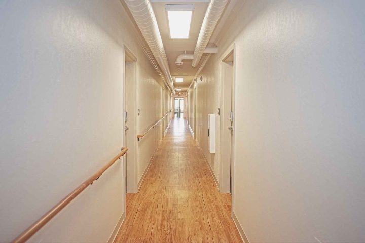Maple Hills Apartments Renovation Minneapolis corridor — Image: VMWP
