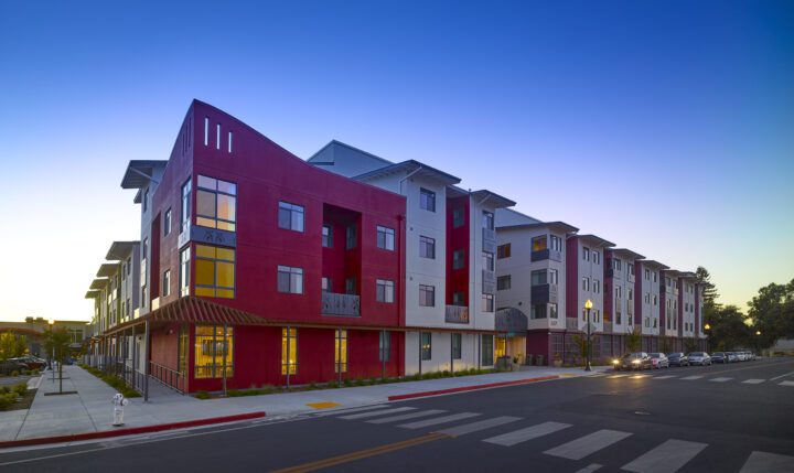 MidPen's Casa Roseland , VMWP affordable housing architect, dusk corner — Image: Ken Gutmaker