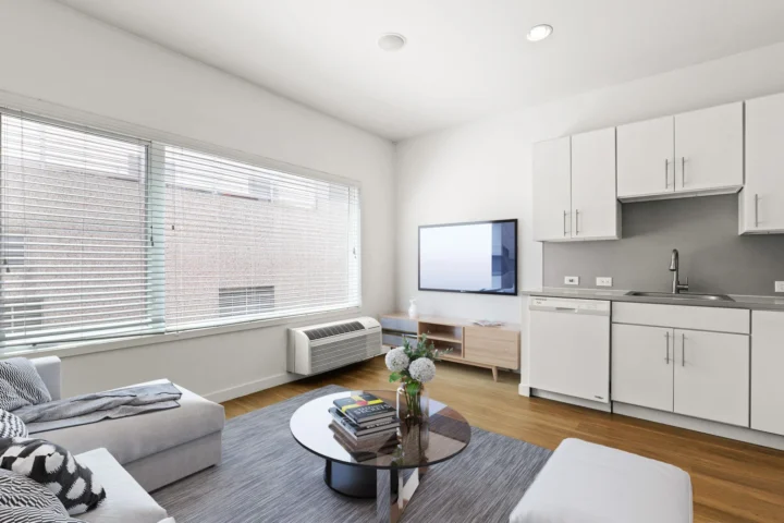 Eliot Flats Modular Housing living room VMWP — Image: cornerstoneapartments.com
